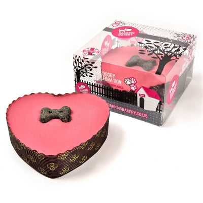 De blaffende bakkerij-yoghurt bedekte pawty cake roze hart met kaars