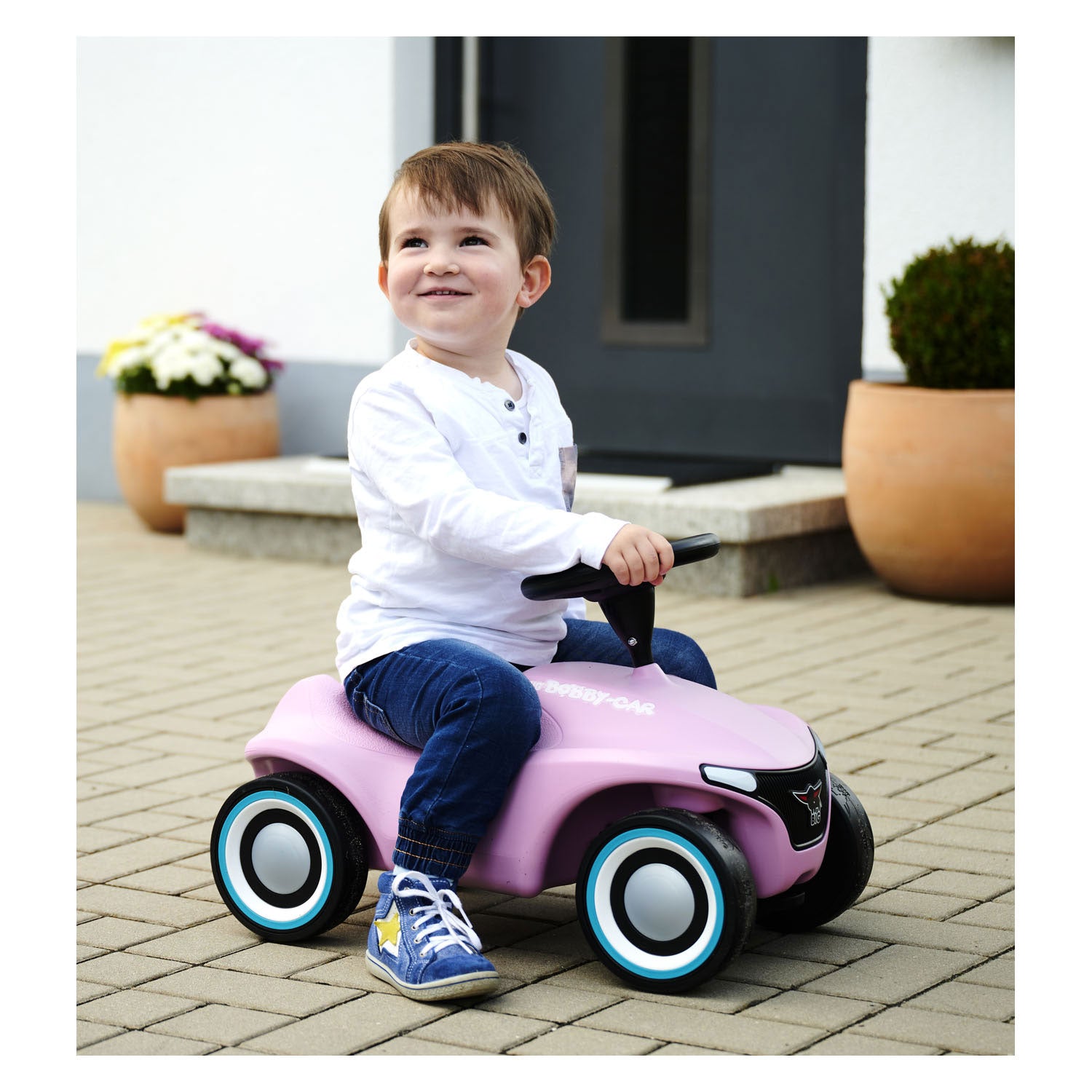 Grote bobby auto neo roze loopauto